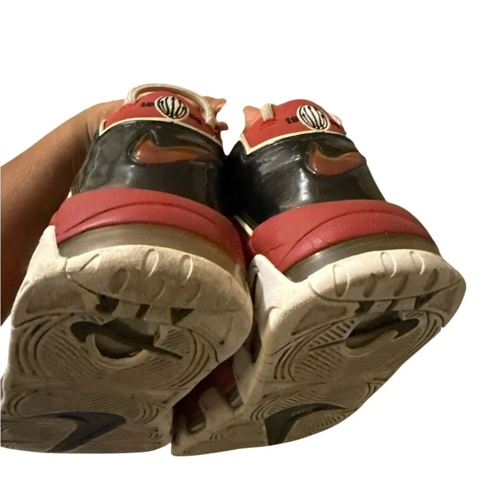 This is a pair of Nike Air More Uptempo '96 basketball shoes in a red, black.